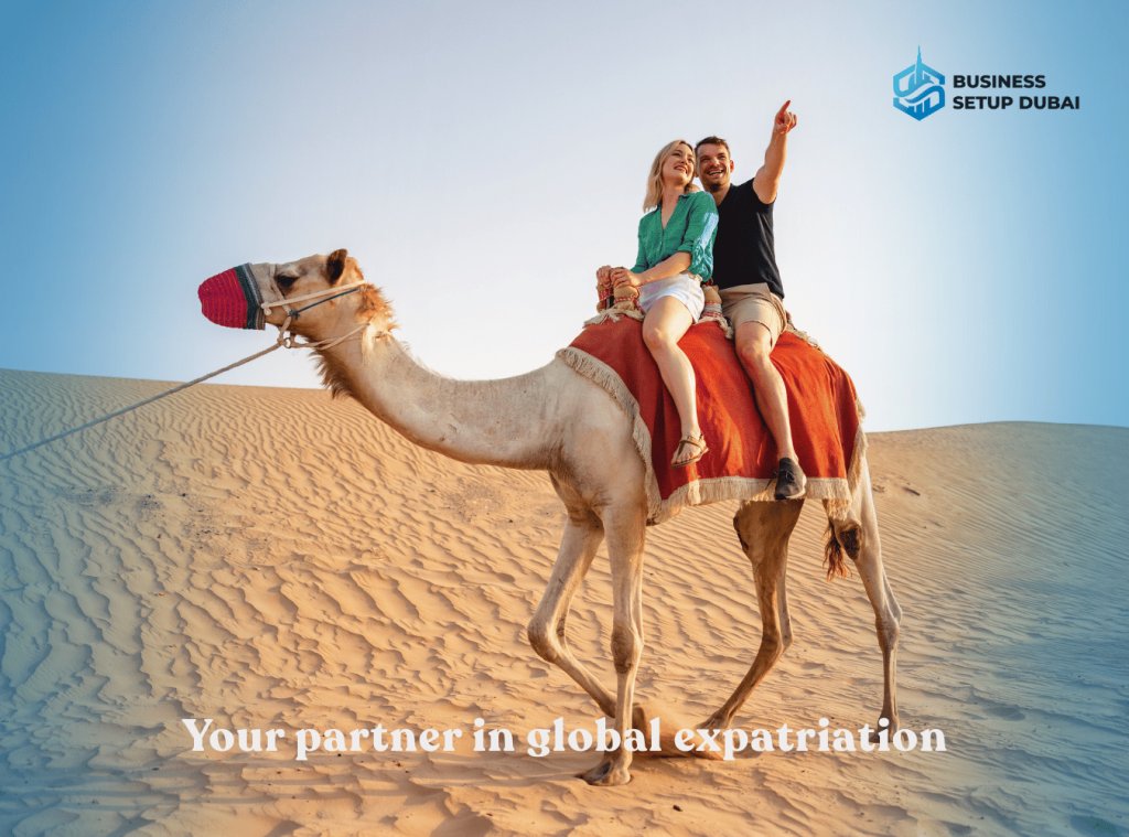 A couple riding a camel in the Dubai desert, symbolizing relocation, expatriation, and obtaining a residence visa in Dubai